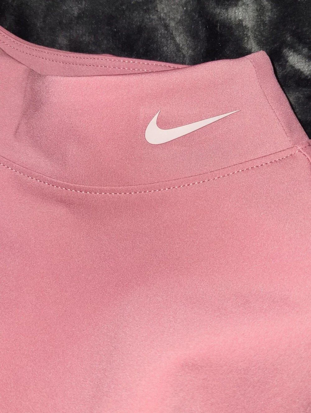 pink Nike Pro Dri-FIT crop top featuring distinctive side-cutout details